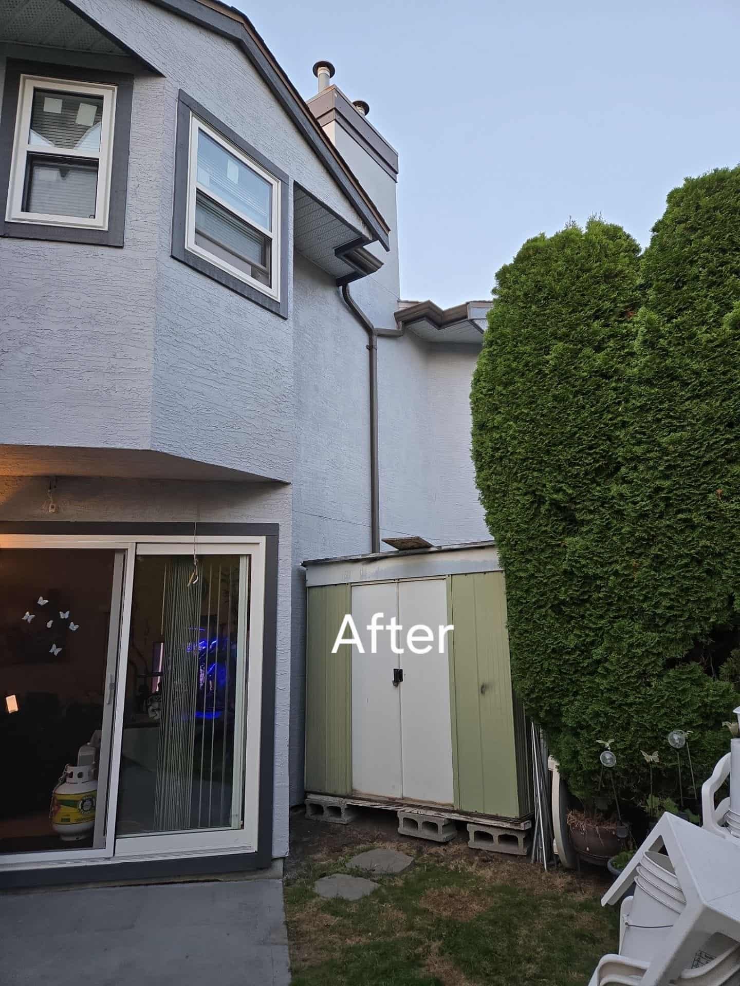 Fence and woodwork after staining — wide view